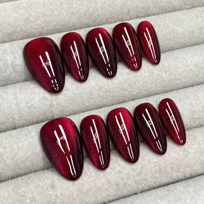 Cool and sophisticated black base with burgundy cat-eye design, almond-shaped handmade nails - RT