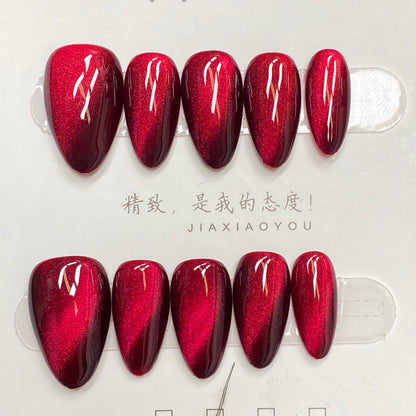 Cool and sophisticated black base with burgundy cat-eye design, almond-shaped handmade nails - RT